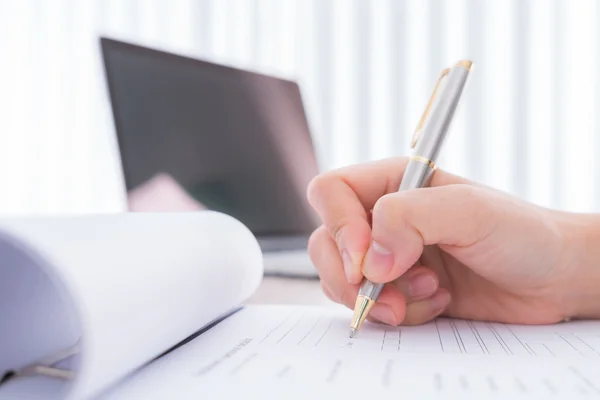 Hand with pen over application for — Stock Photo, Image