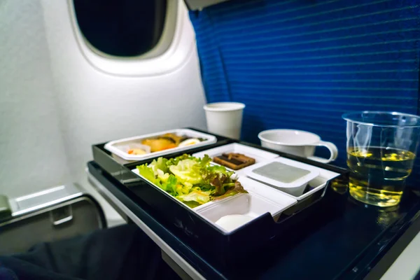 Tray of food on plane . — Stock Photo, Image