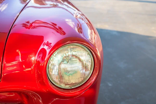 Headlight of a vintage car . ( Filtered image processed vintage