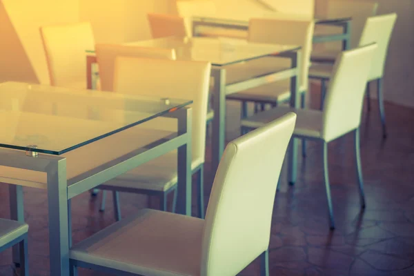 Tables and chairs in restaurant ( Filtered image processed vinta — Stock Photo, Image