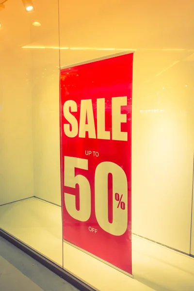 Red store discount sign on a shop window . ( Filtered image proc — Stock Photo, Image