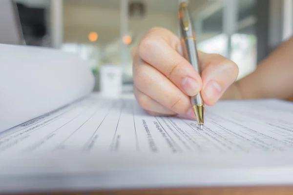 Hand with pen over application form . — Stock Photo, Image
