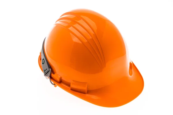 Capacete de construção de plástico rígido laranja em fundo branco  . — Fotografia de Stock