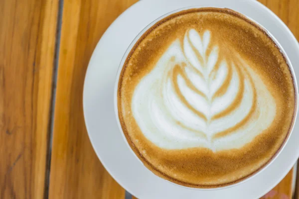 Latte Coffee art on the wooden table . — Stock Photo, Image