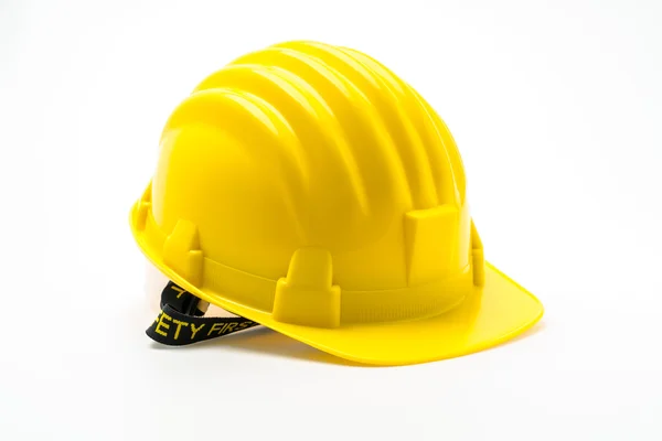 Casco de construcción de plástico duro amarillo sobre fondo blanco  . — Foto de Stock