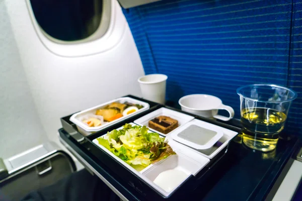 Tray of food on plane . — Stock Photo, Image