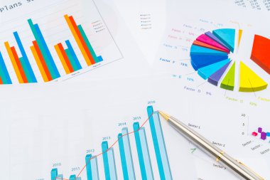 Financial charts with pen . clipart