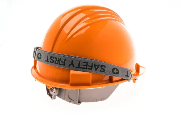 白い背景の上のオレンジ色のハード プラスチック製の建設ヘルメット . — ストック写真