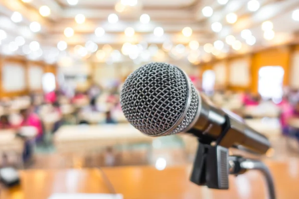 Black microphone in conference room .