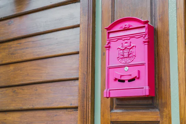 Red mail box on wood wall — Stock Photo, Image
