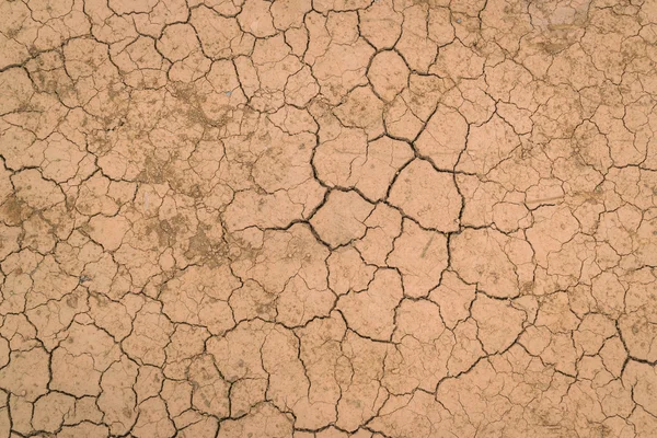 Textura del suelo seca y agrietada  . — Foto de Stock