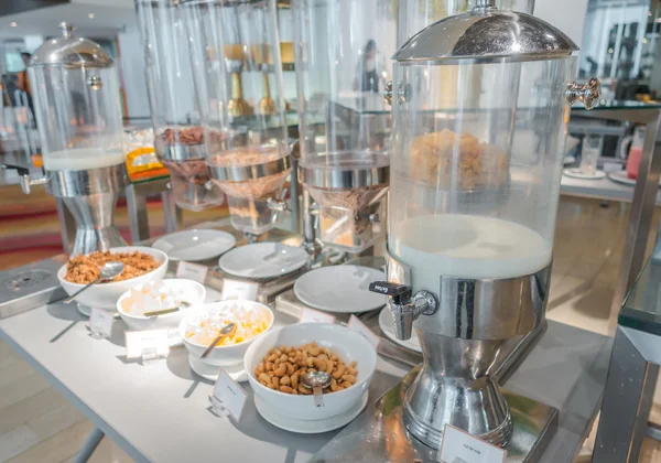 Cereal dispensers offering various kind of cereals in buffet at — Stock Photo, Image