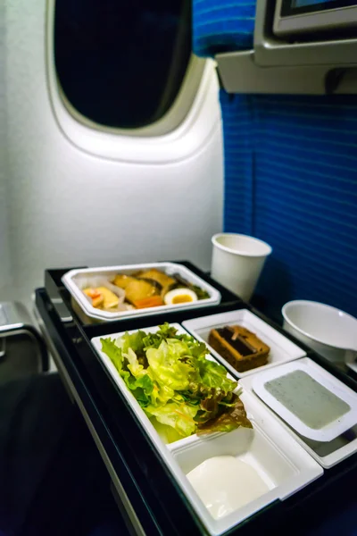 Tray of food on plane . — Stock Photo, Image