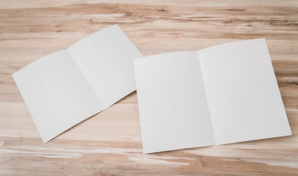 Bifold white template paper on wood texture . — Stock Photo, Image