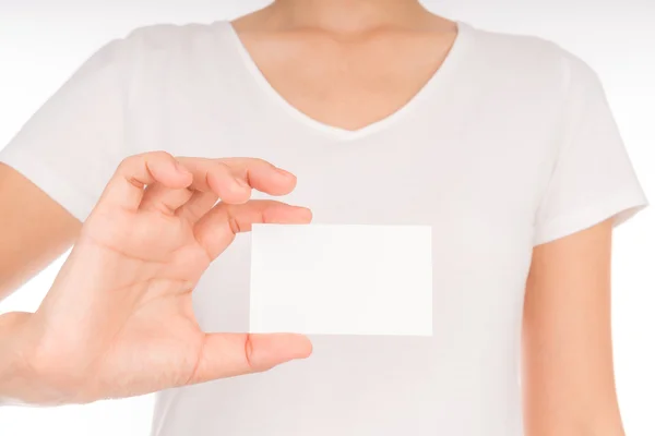 Vrouwen hand met blanco papier visitekaartje geïsoleerd op witte b — Stockfoto