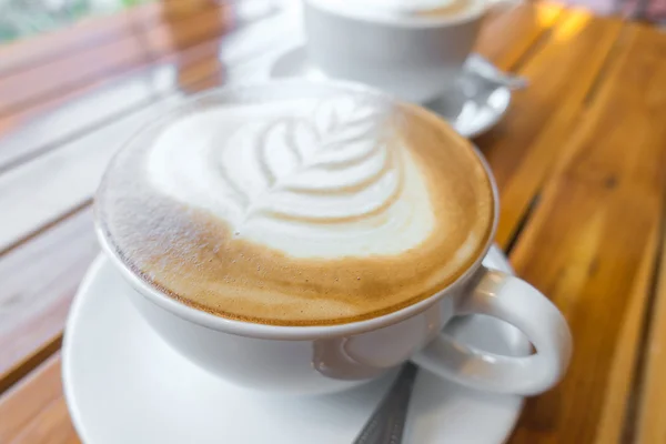 Latte Coffee art on the wooden table . — Stock Photo, Image