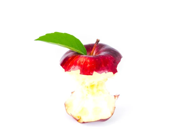 Red apple with green leaf and missing a bite . — Stock Photo, Image