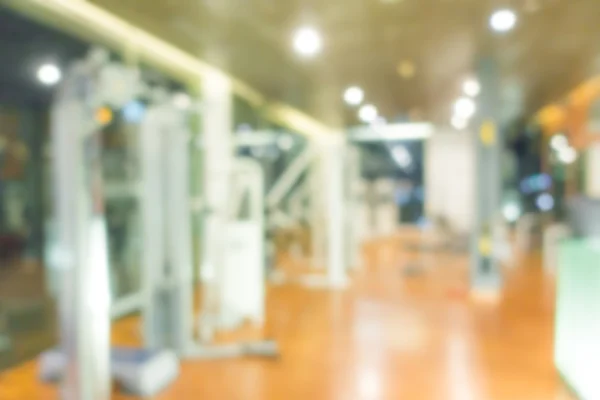 Abstrakt oskärpa fitnesscenter med traineger utrustning . — Stockfoto