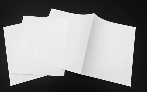 Bifold white template paper on black background . — Stock Photo, Image