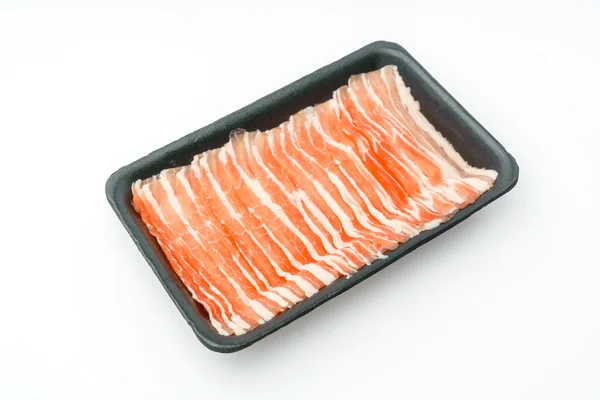 Slide van rauw varkensvlees op witte achtergrond . — Stockfoto