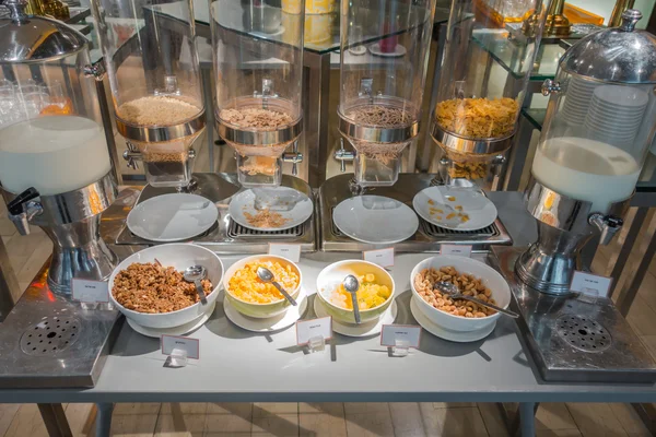 Cereal dispensers offering various kind of cereals in buffet at — Stock Photo, Image