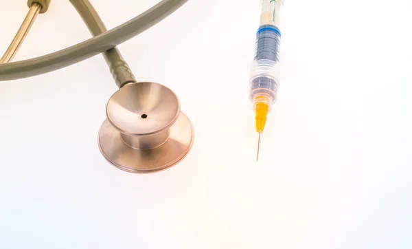Plastic syringe with  stethoscope .  ( Filtered image processed — Stock Photo, Image