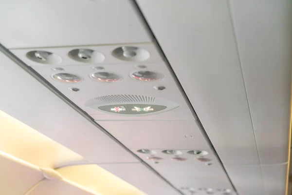 No smoking sign and seat belt sign on the airplane . — Stock Photo, Image