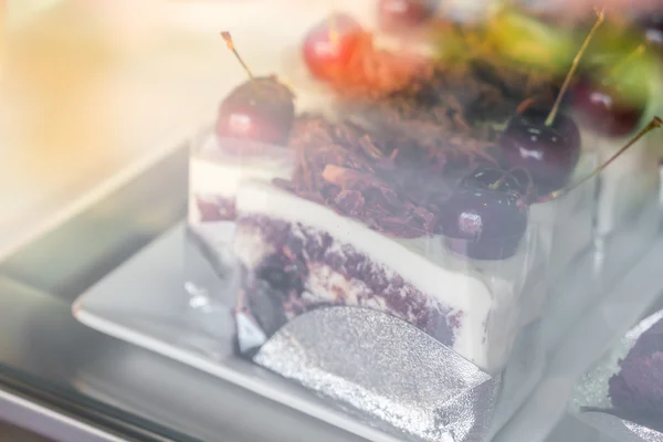 Chocolate cake with red cherries . — Stock Photo, Image