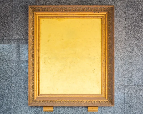 Antique golden frame on wall — Stock Photo, Image