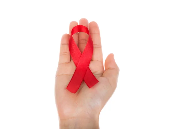 AIDS şerit beyaz arka plan üzerinde izole elinde — Stok fotoğraf