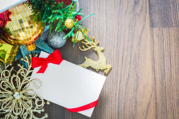 Christmas card and Santa Hat with decorations on wooden backgrou — Stock Photo, Image