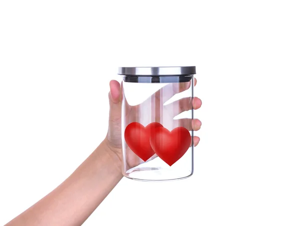 Mão segurar corações vermelhos em frasco de vidro com tampa de alumínio isolado em — Fotografia de Stock