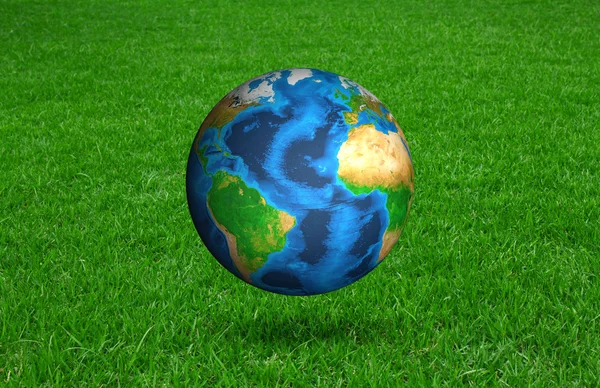 Earth in Fresh spring green grass (Elements of this image furnis — Stock Photo, Image