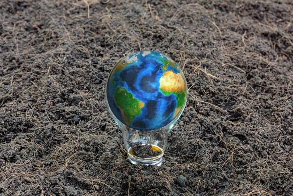 Earth in light bulb (Elements of this image furnished by NASA) — Stock Photo, Image