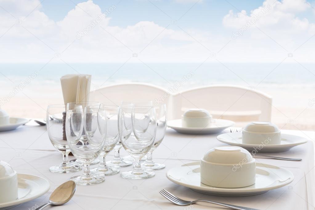 Table setting near beach restaurant