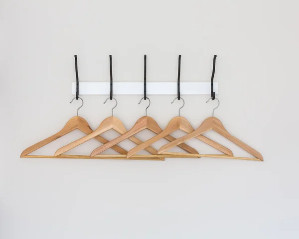 Wood coat hanger on wall — Stock Photo, Image