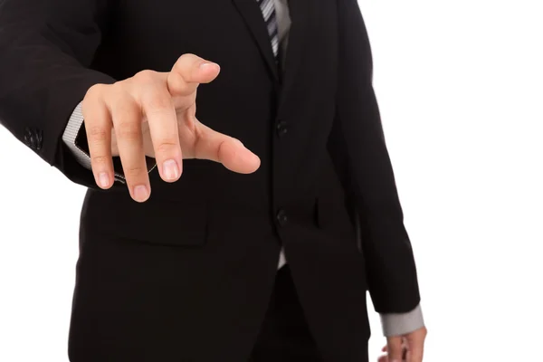 Hombre de negocios tocando una pantalla imaginaria contra fondo blanco —  Fotos de Stock