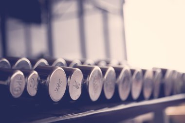 Sports dumbbells  ( Filtered image processed vintage effect. ) clipart