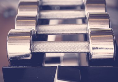 Sports dumbbells  ( Filtered image processed vintage effect. ) clipart