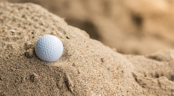 Golf ball in sand bunker — Stock Photo, Image