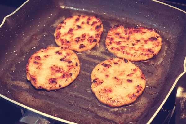 Hamburgers in a grill pan ( Filtered image processed vintage eff — Stock Photo, Image