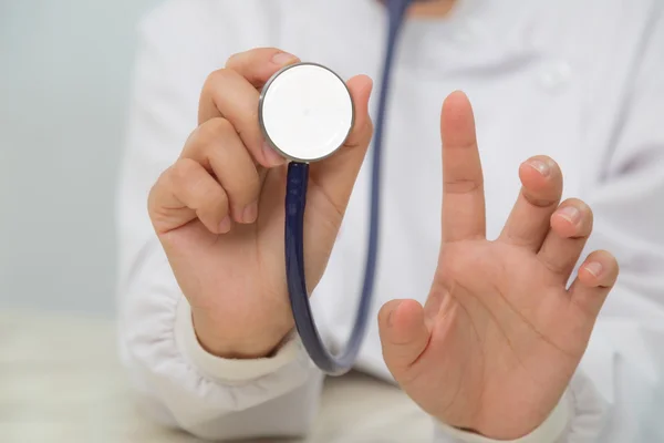 Doctor with stethoscope in the hands — Stock Photo, Image