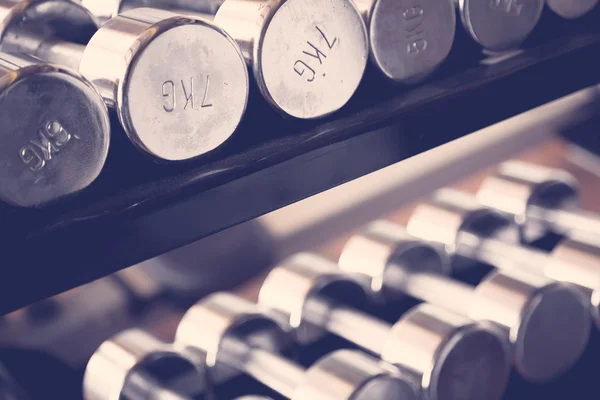 Sports dumbbells  in gym — Stock Photo, Image