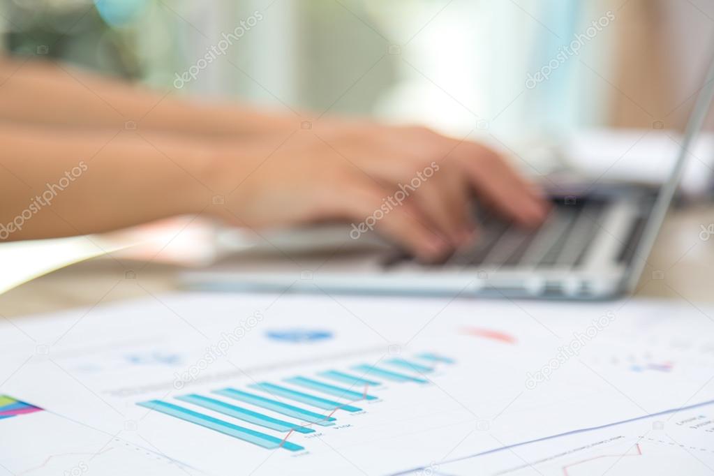 Business woman hand typing on laptop keyboard