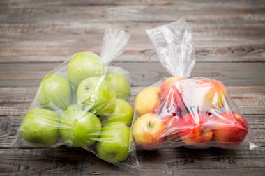 Apple fruit in plastic bags clipart