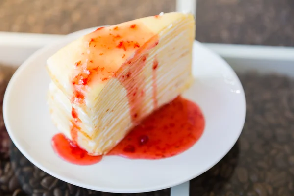 Crepe cake with strawberry sauce — Stock Photo, Image