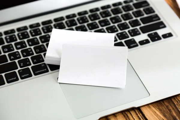 Business card on laptop keyboard — Stock Photo, Image