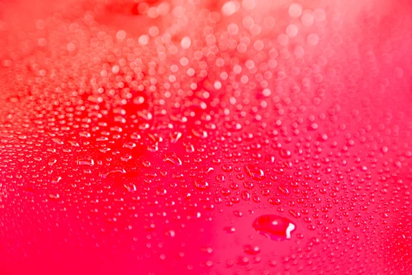 Gotas de água no chão vermelho — Fotografia de Stock