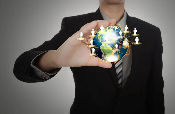 Business man holding the small world in his hands — Stock Photo, Image