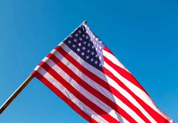 American flag over blue sky — Stock Photo, Image